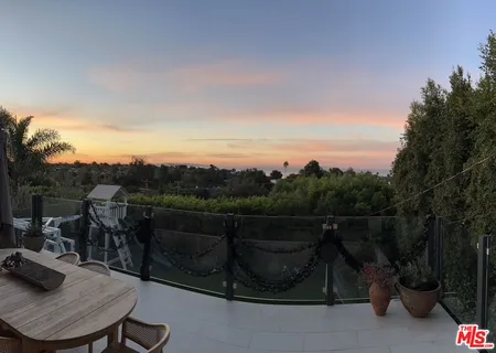 a view of a terrace with sitting area