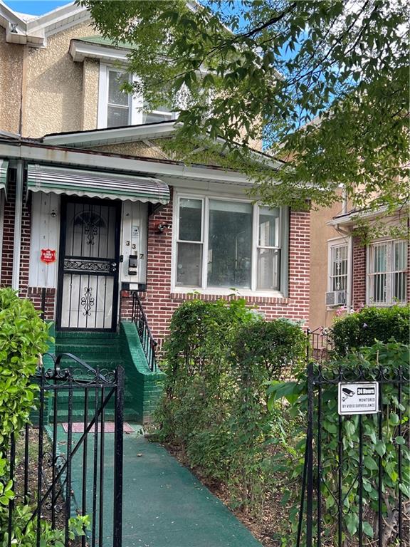 3317 Clarendon Road Brooklyn, NY 11203 - Photo 1 of 11 front view of a house with a small yard