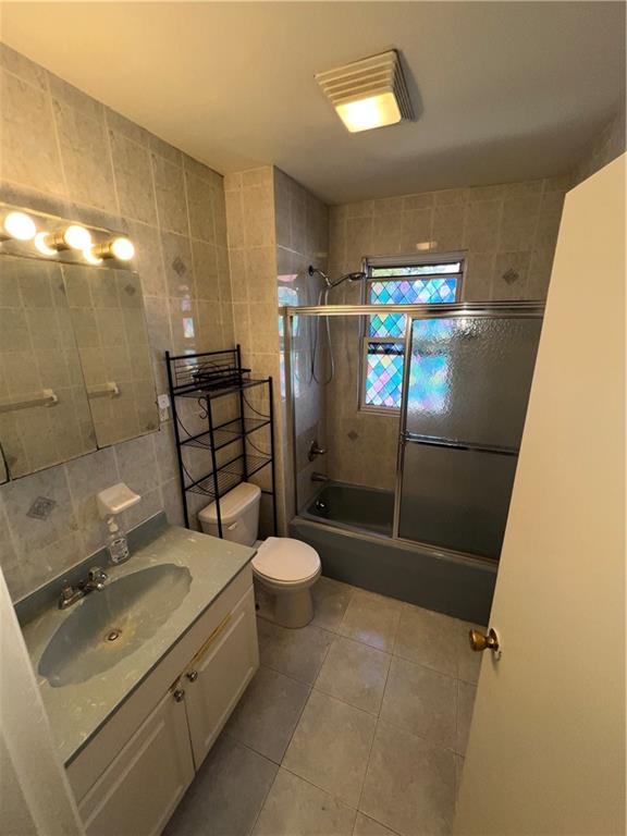3317 Clarendon Road Brooklyn, NY 11203 - Photo 7 of 11 a bathroom with a sink toilet and shower