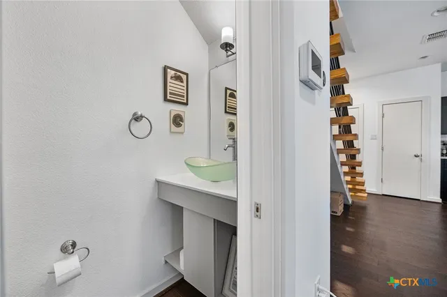 a view of an entryway with wooden floor