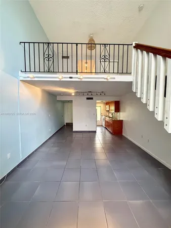 a bedroom with a bed and a book shelf