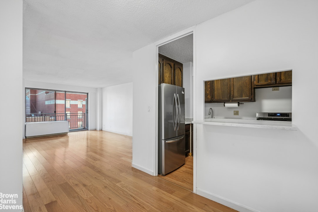 132 East 35th Street, Unit 16F Manhattan, NY 10016 - Photo 2 of 14 a view of a kitchen cabinets and wooden floor