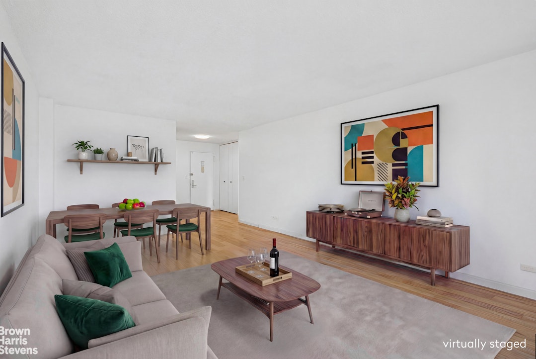132 East 35th Street, Unit 16F Manhattan, NY 10016 - Photo 3 of 14 a living room with furniture and a chair