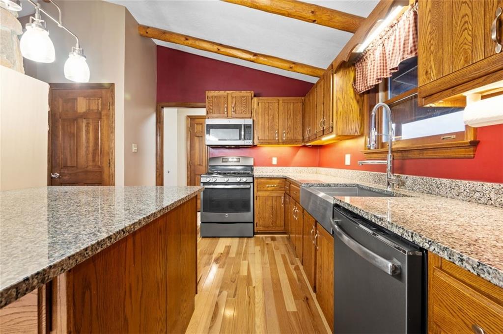 5150 Beech Road Apollo, PA 15613 - Photo 13 of 37 a kitchen with stainless steel appliances granite countertop a stove a sink and a refrigerator