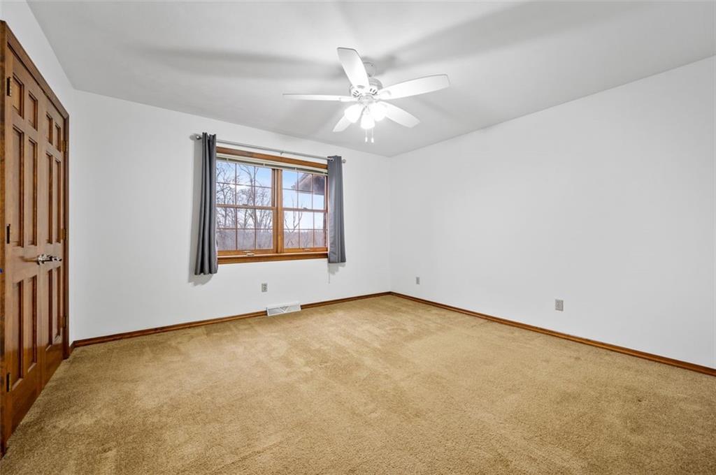 5150 Beech Road Apollo, PA 15613 - Photo 17 of 37 an empty room with chandelier fan and windows