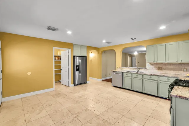a large bathroom with a large mirror vanity and shower
