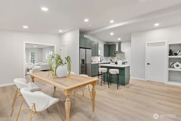a kitchen with a table and chairs in it