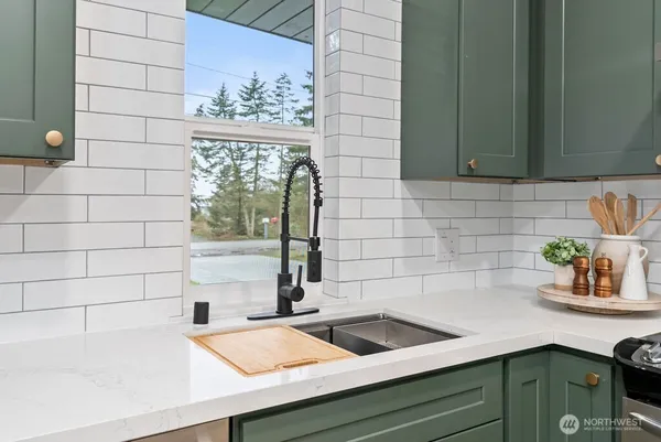 a kitchen with a sink and a window