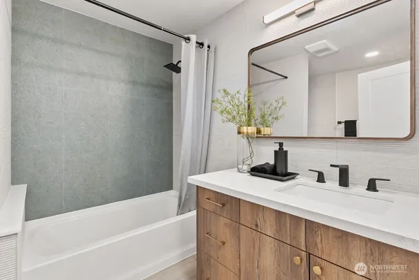 a bathroom with a sink and a bathtub