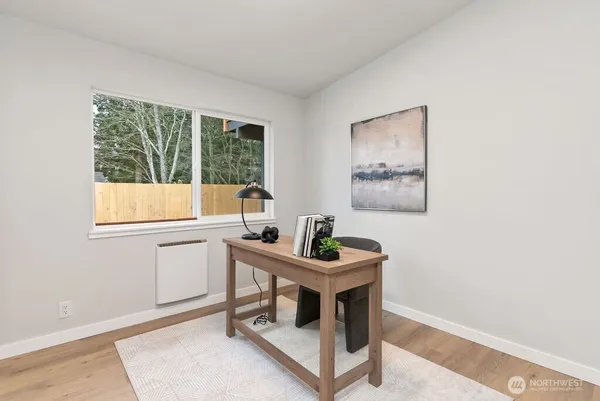 a room with a table and windows