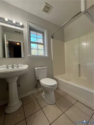 a bathroom with a sink toilet a mirror and shower