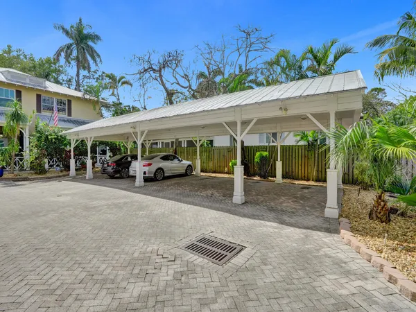 a view of a car park in front of house