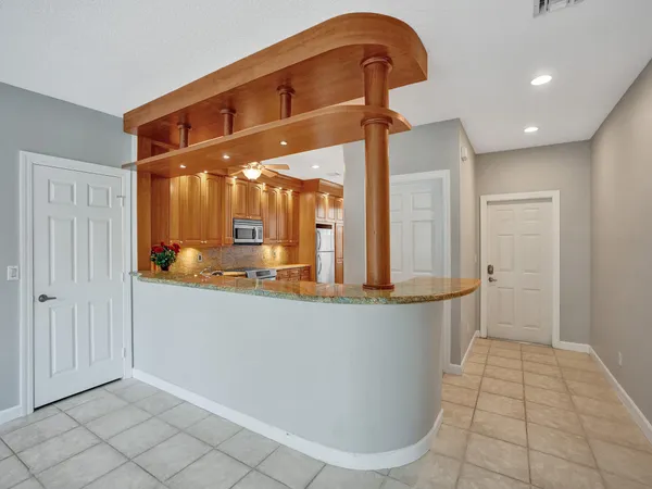a view of a living room and entryway