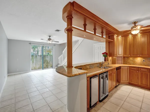 a kitchen with stainless steel appliances granite countertop a sink and cabinets