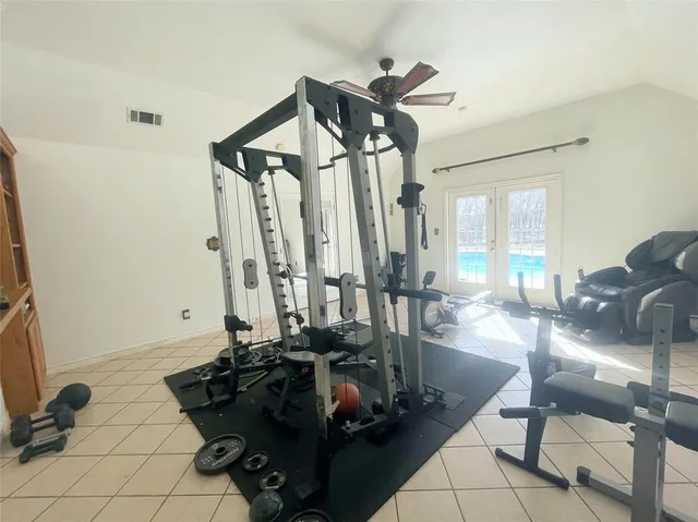 a room with lots of chairs and mirrors