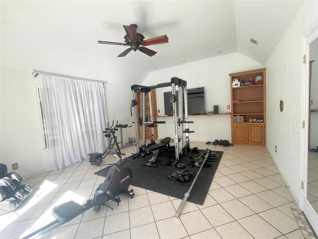 286 West Ridge Street Decatur, TX 76234 - Photo 19 of 35 a living room with patio furniture and a chandelier