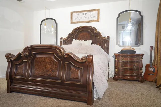 a bedroom with a bed and a dresser
