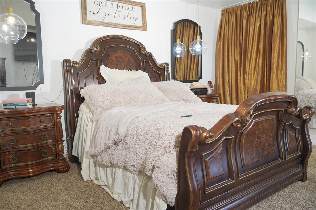 286 West Ridge Street Decatur, TX 76234 - Photo 26 of 35 a bedroom with a bed and a dresser