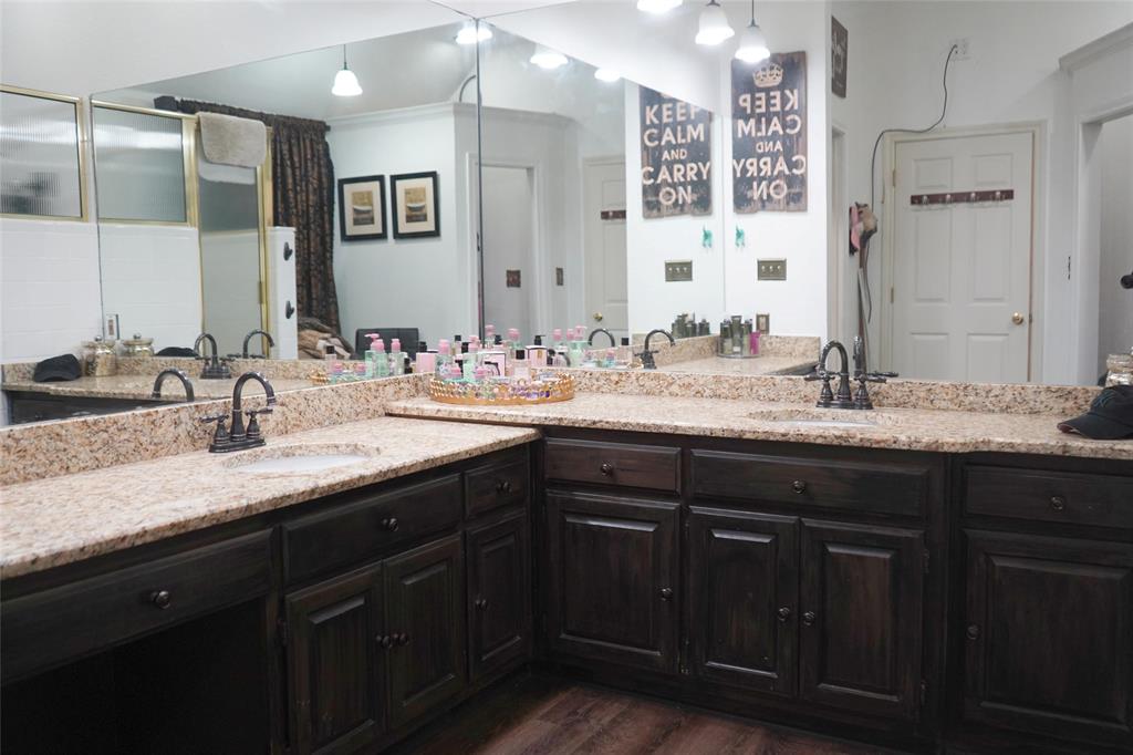 286 West Ridge Street Decatur, TX 76234 - Photo 27 of 35 a bathroom with double vanity sinks and a large mirror