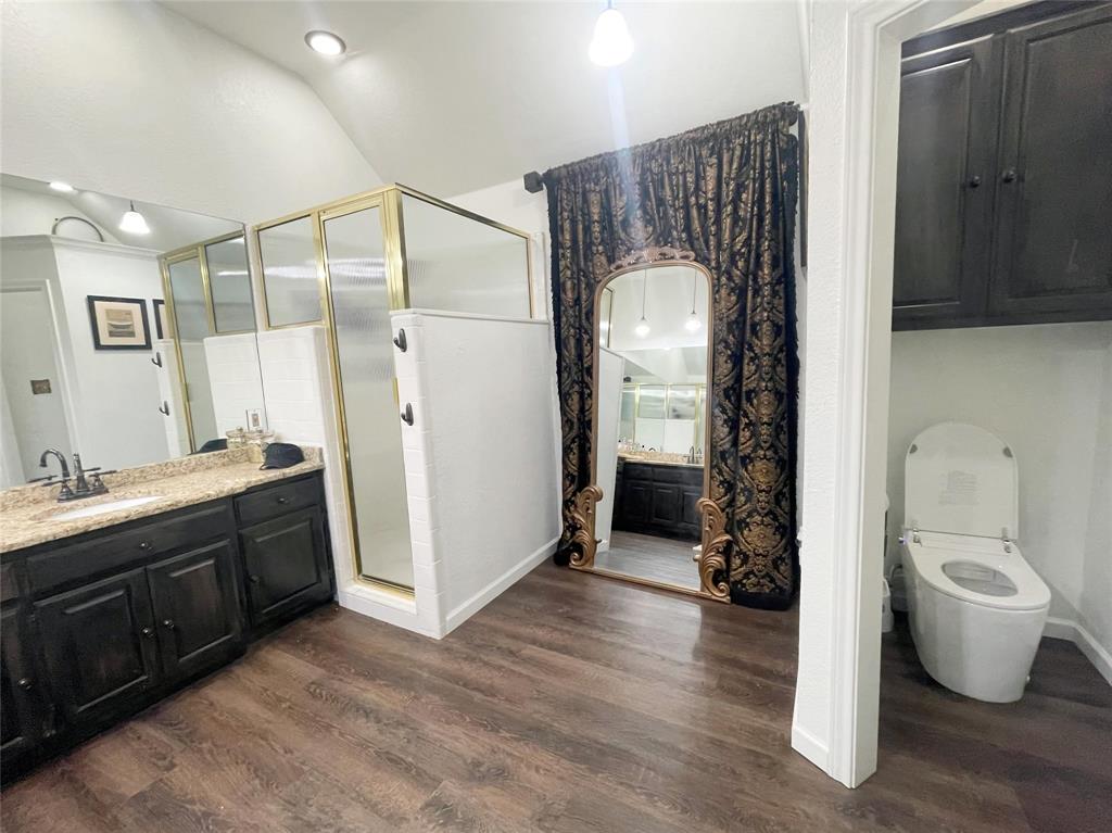 286 West Ridge Street Decatur, TX 76234 - Photo 33 of 35 a bathroom with a toilet sink and mirror