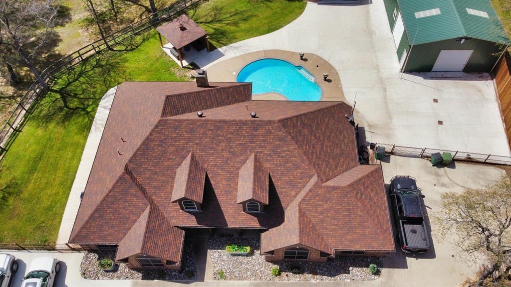 286 West Ridge Street Decatur, TX 76234 - Photo 34 of 35 an aerial view of houses with outdoor space