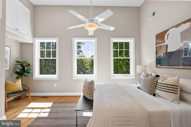 a en suite bathroom with a granite countertop sink and a mirror