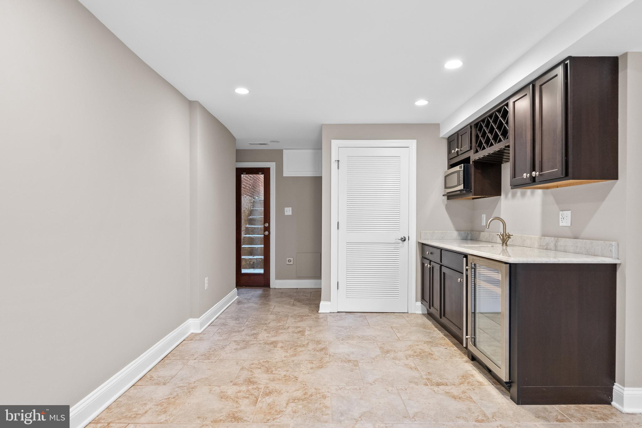 610 Independence Avenue Southeast Washington, DC 20003 - Photo 23 of 26 a view of a kitchen with stainless steel appliances granite countertop a refrigerator and a sink
