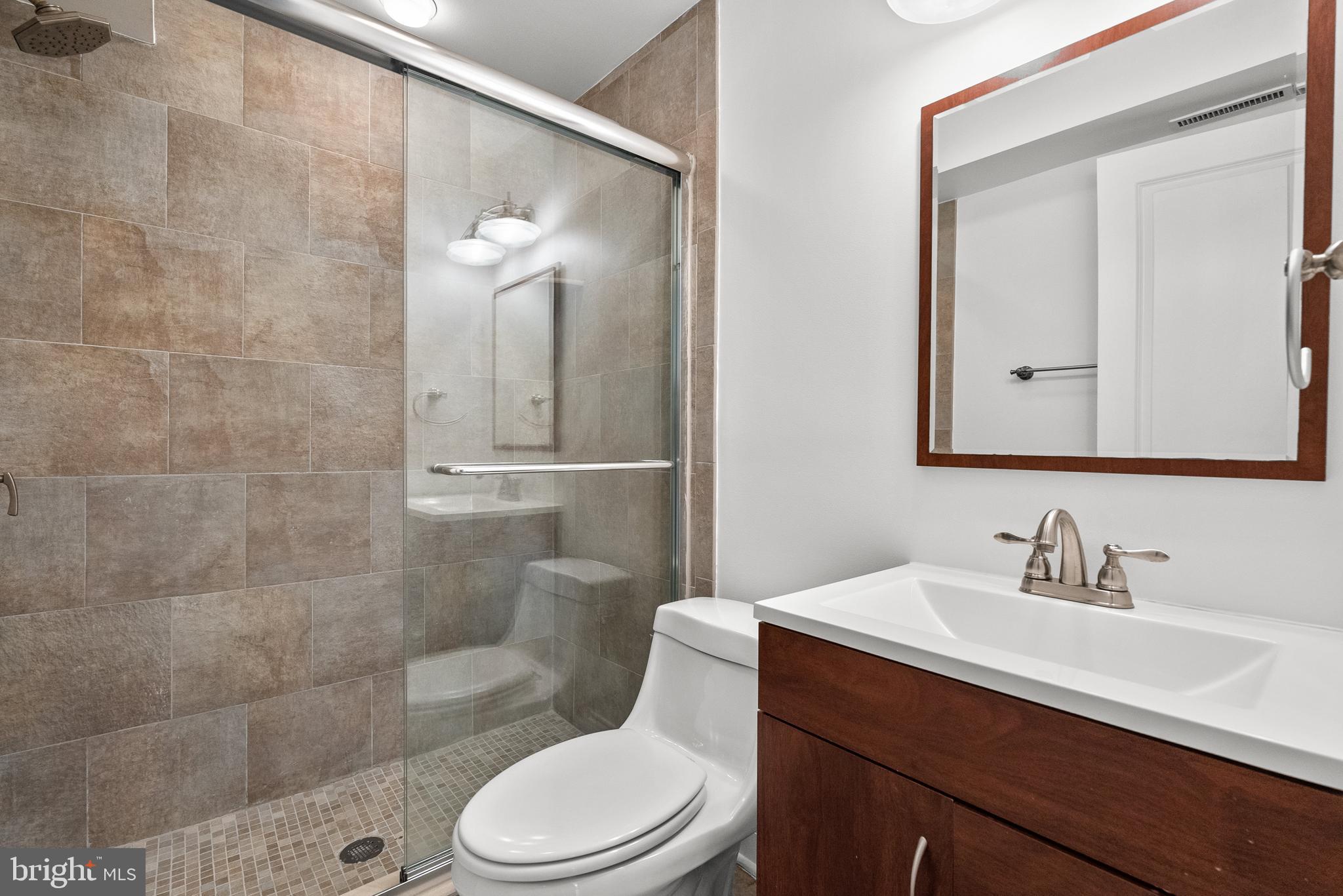 610 Independence Avenue Southeast Washington, DC 20003 - Photo 24 of 26 a bathroom with a sink a toilet and shower