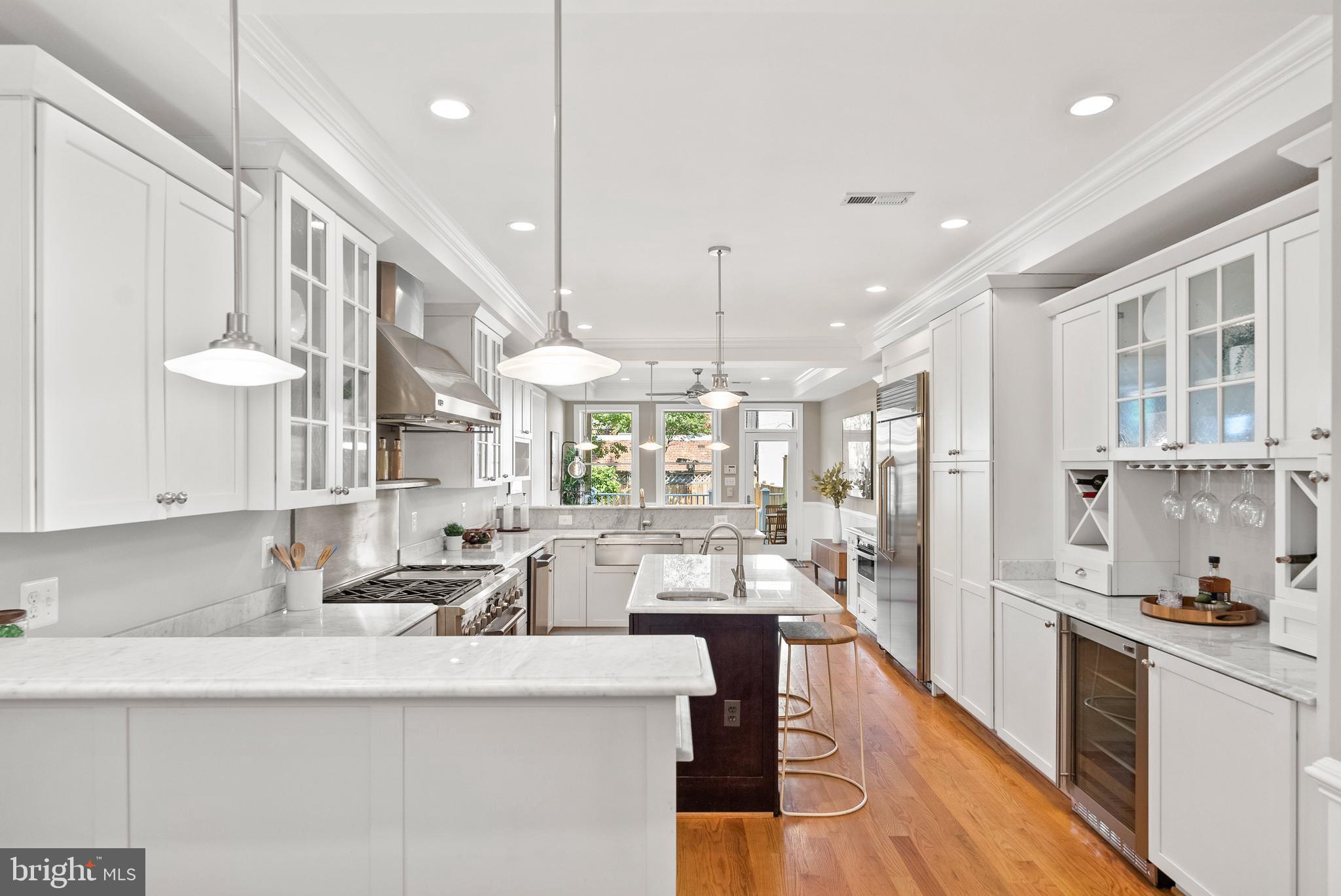610 Independence Avenue Southeast Washington, DC 20003 - Photo 5 of 26 a large kitchen with a large window and stainless steel appliances