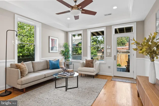 a balcony with furniture and wooden floor
