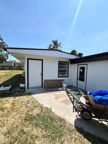 a view of a backyard of the house