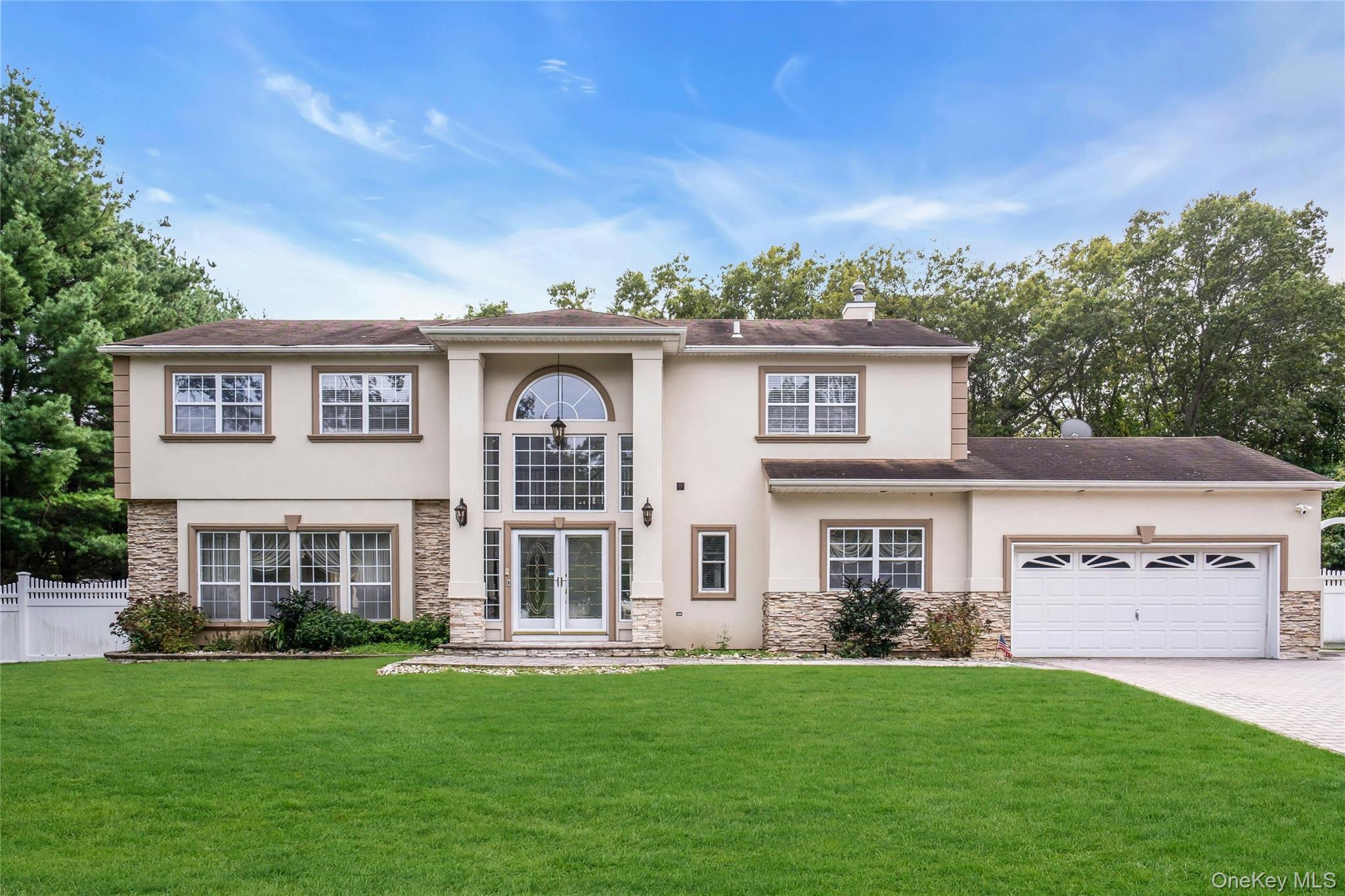 2 Wisteria Lane Lake Grove, NY 11755 - Photo 1 of 43 front view of a house with a yard