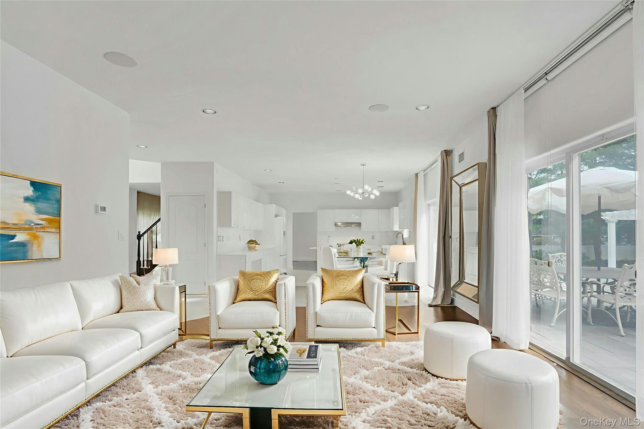 2 Wisteria Lane Lake Grove, NY 11755 - Photo 18 of 43 a living room with furniture a rug and a large window