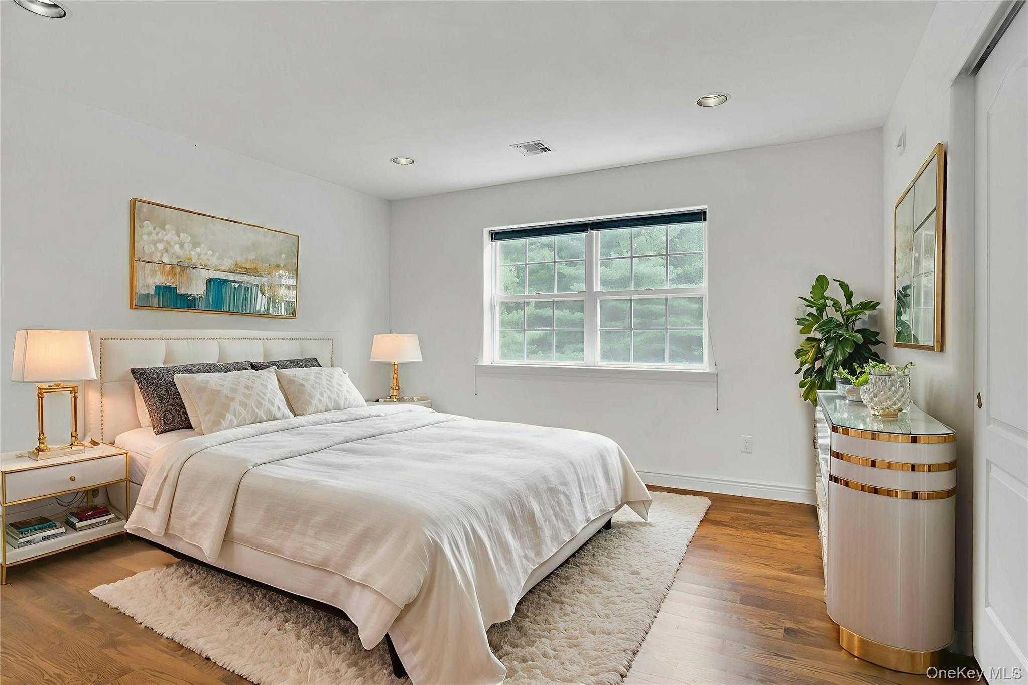 2 Wisteria Lane Lake Grove, NY 11755 - Photo 25 of 43 a bedroom with a bed and a potted plant