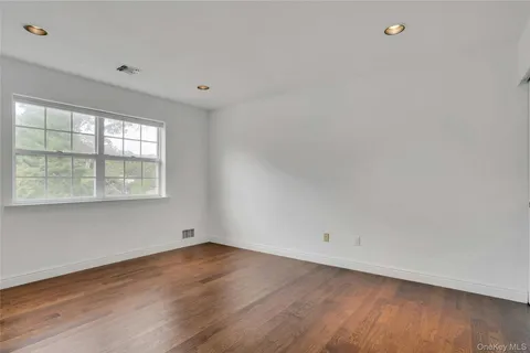 a bedroom with a large bed and a couch