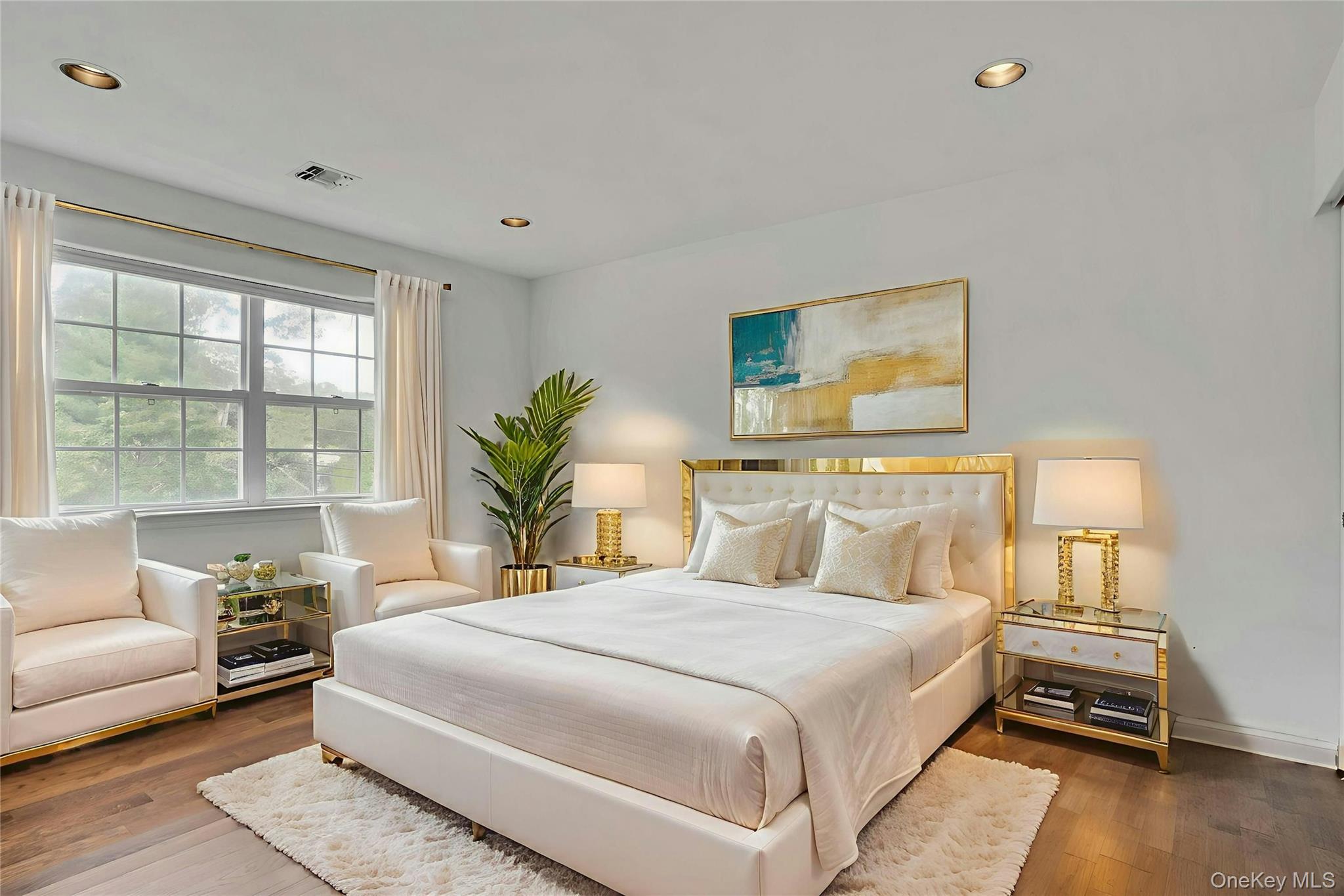 2 Wisteria Lane Lake Grove, NY 11755 - Photo 27 of 43 a bedroom with a large bed and a couch