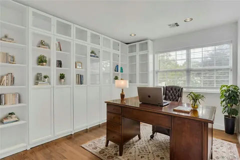 a view of room with hardwood floor and window
