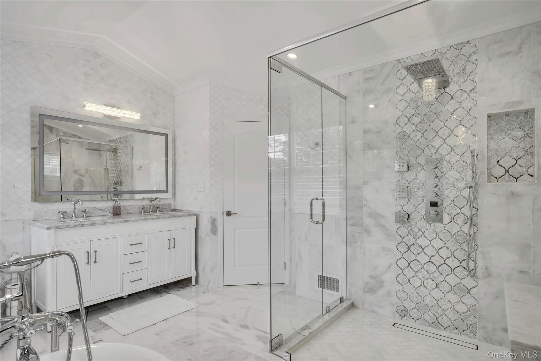 2 Wisteria Lane Lake Grove, NY 11755 - Photo 34 of 43 a bathroom with a double vanity sink mirror and shower