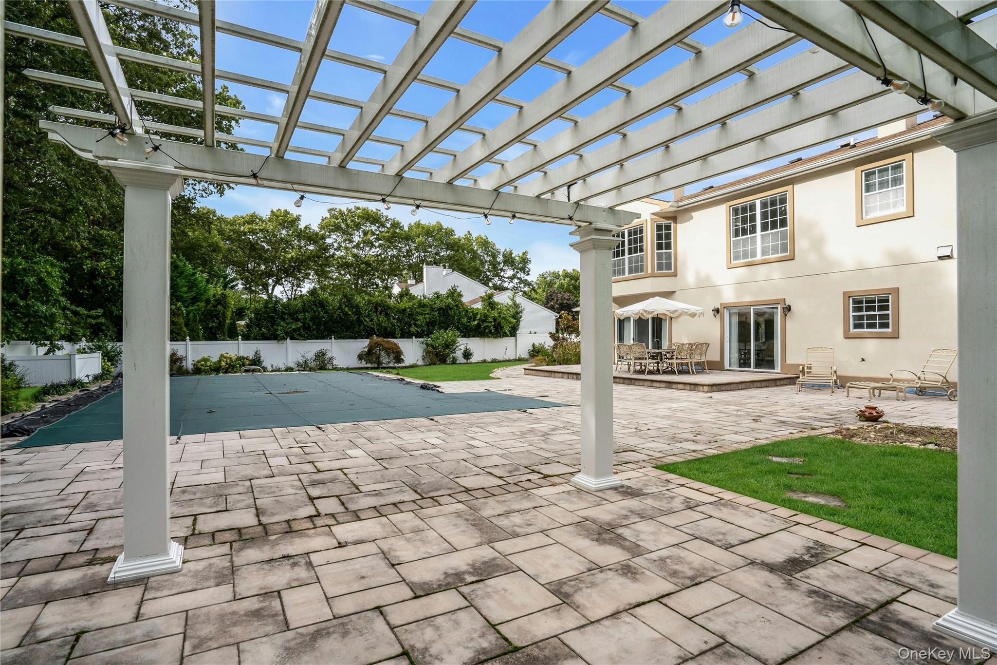 2 Wisteria Lane Lake Grove, NY 11755 - Photo 38 of 43 a front view of a house with a yard