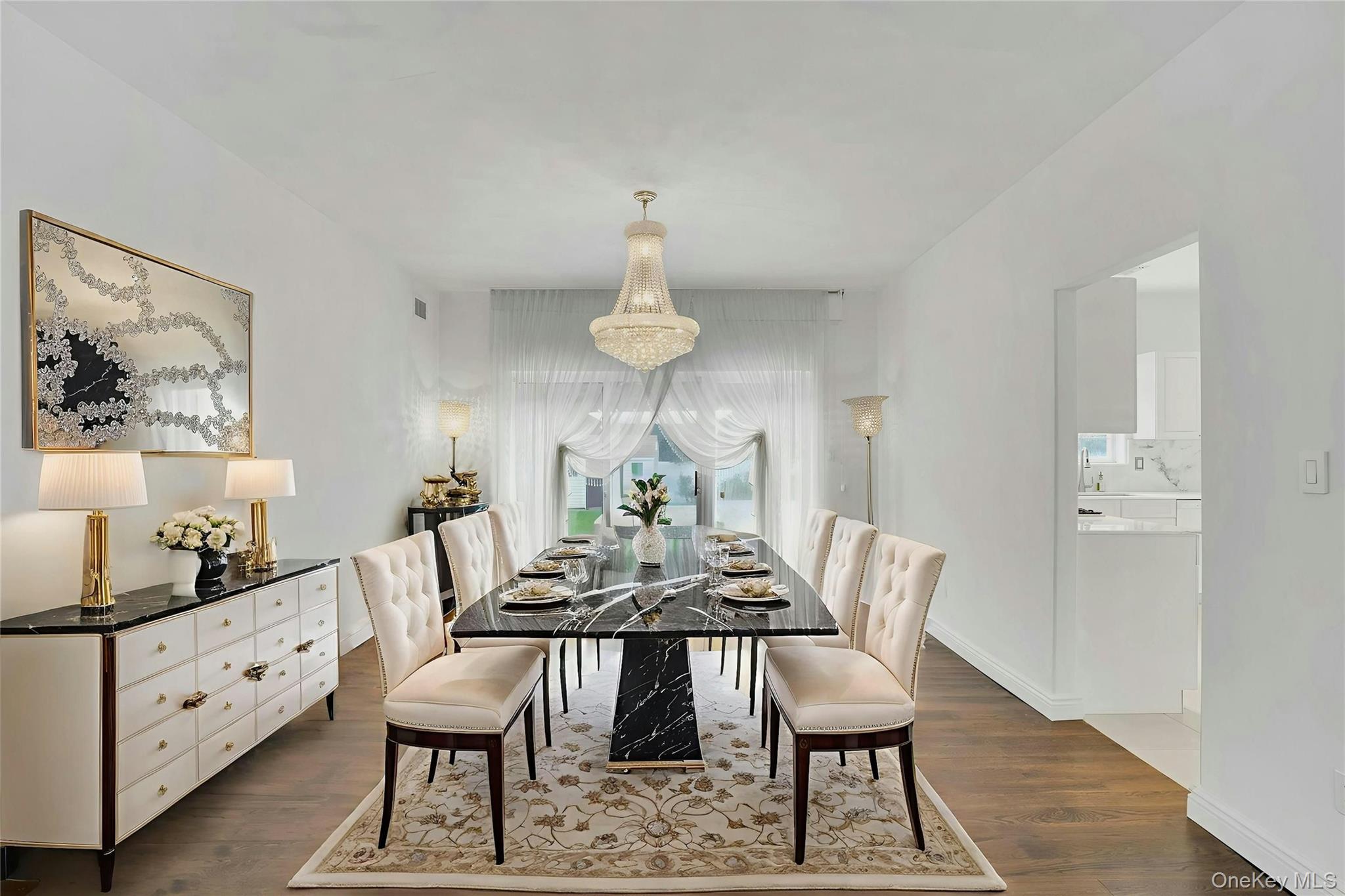 2 Wisteria Lane Lake Grove, NY 11755 - Photo 10 of 43 a view of a dining room with furniture and wooden floor
