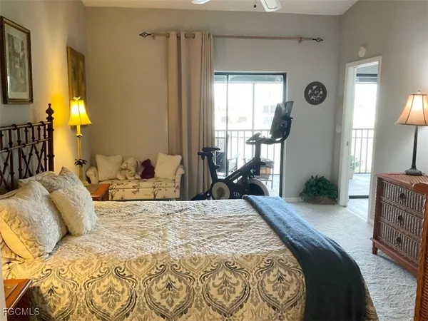 a bedroom with a bed and a mirror