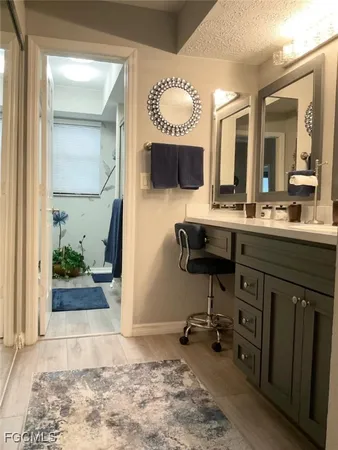a view of a bathroom with dual sinks