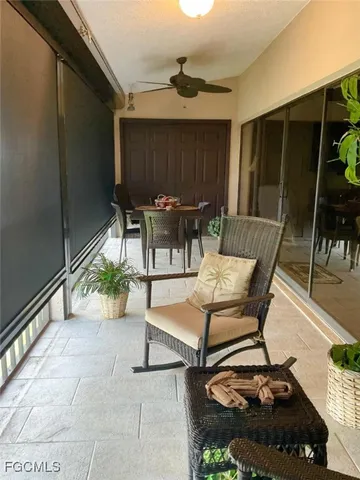 a view of a patio with table and chairs and potted plants
