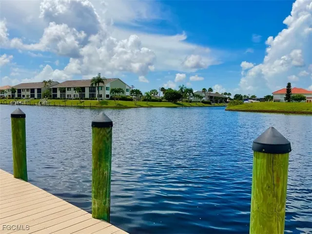 a view of a lake with a house in the background