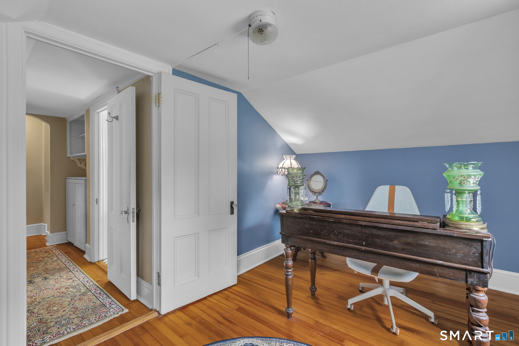 808 Branch Road Suffield, CT 06078 - Photo 25 of 40 a view of a hallway with wooden floor and furniture
