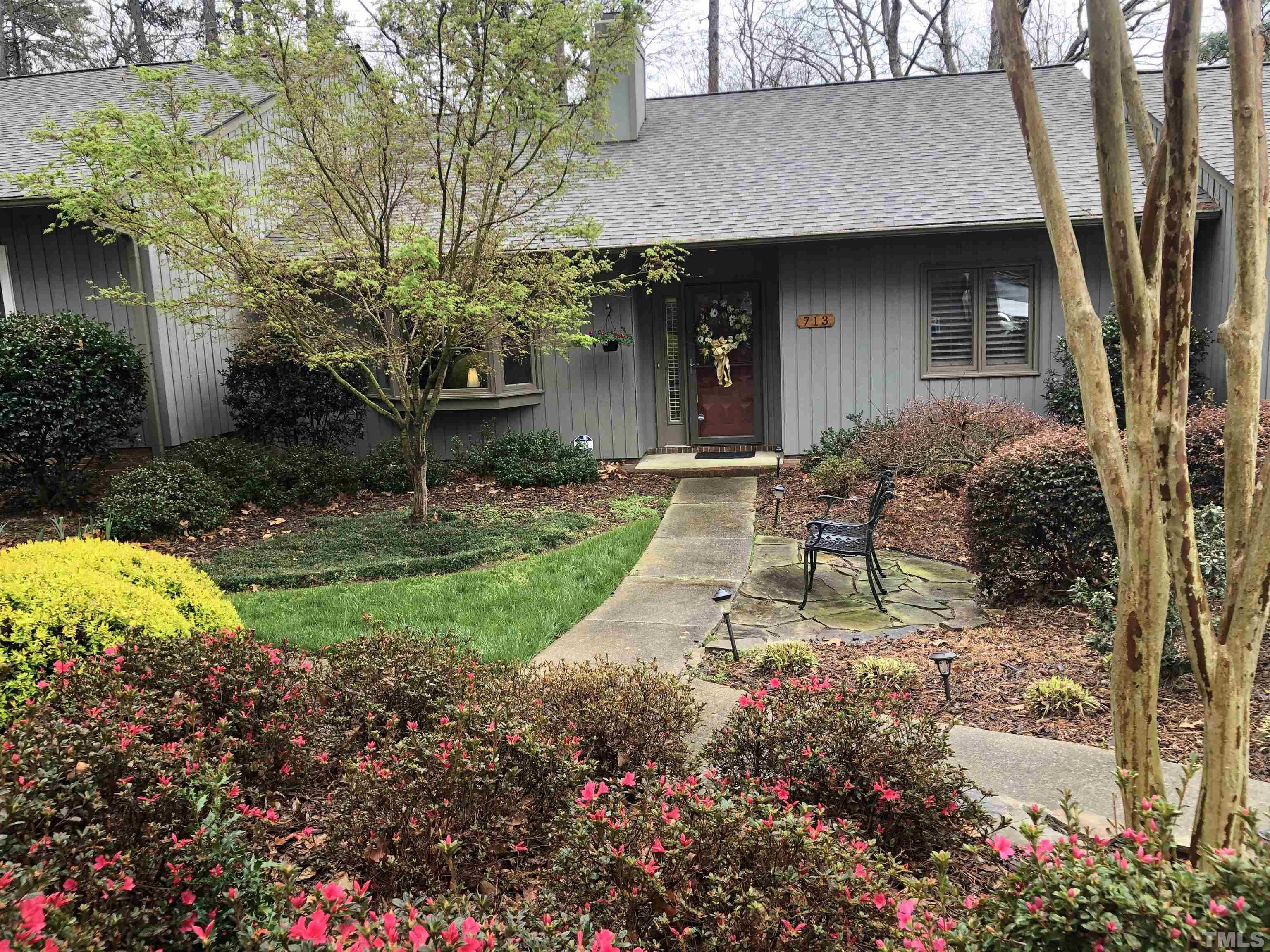 713 Tan Tara Square Raleigh, NC 27615 - Photo 1 of 35 a front view of house with yard and trees around