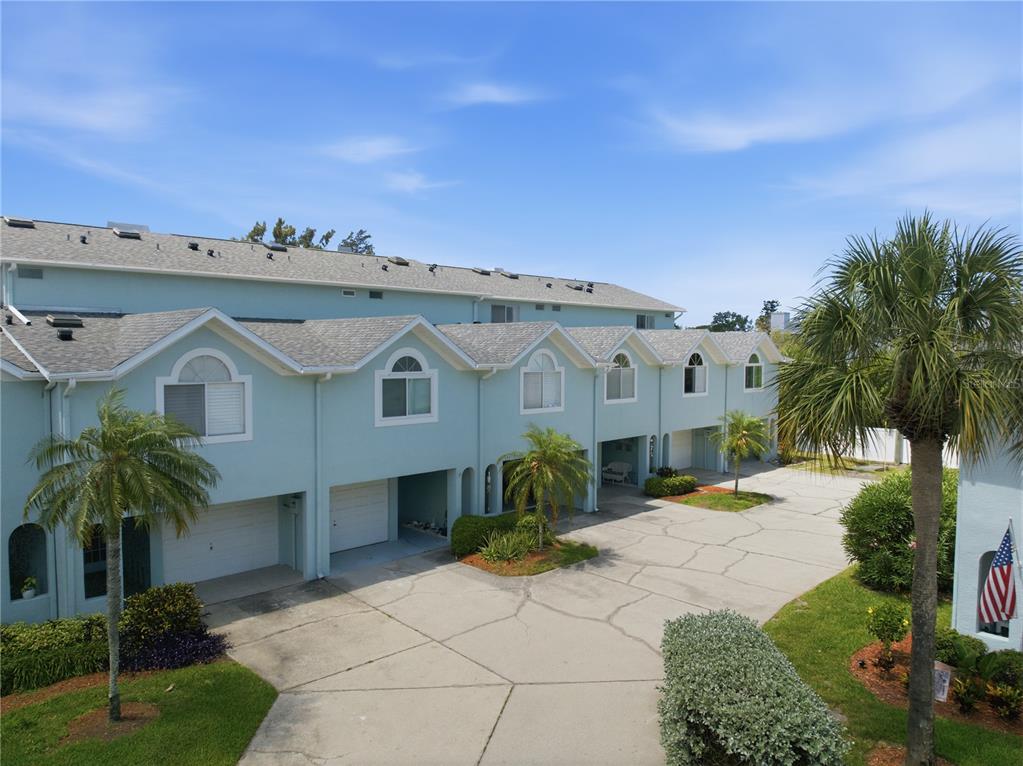 643 Garland Circle Indian Rocks Beach, FL 33785 - Photo 58 of 81 a view of a house with a yard and potted plants