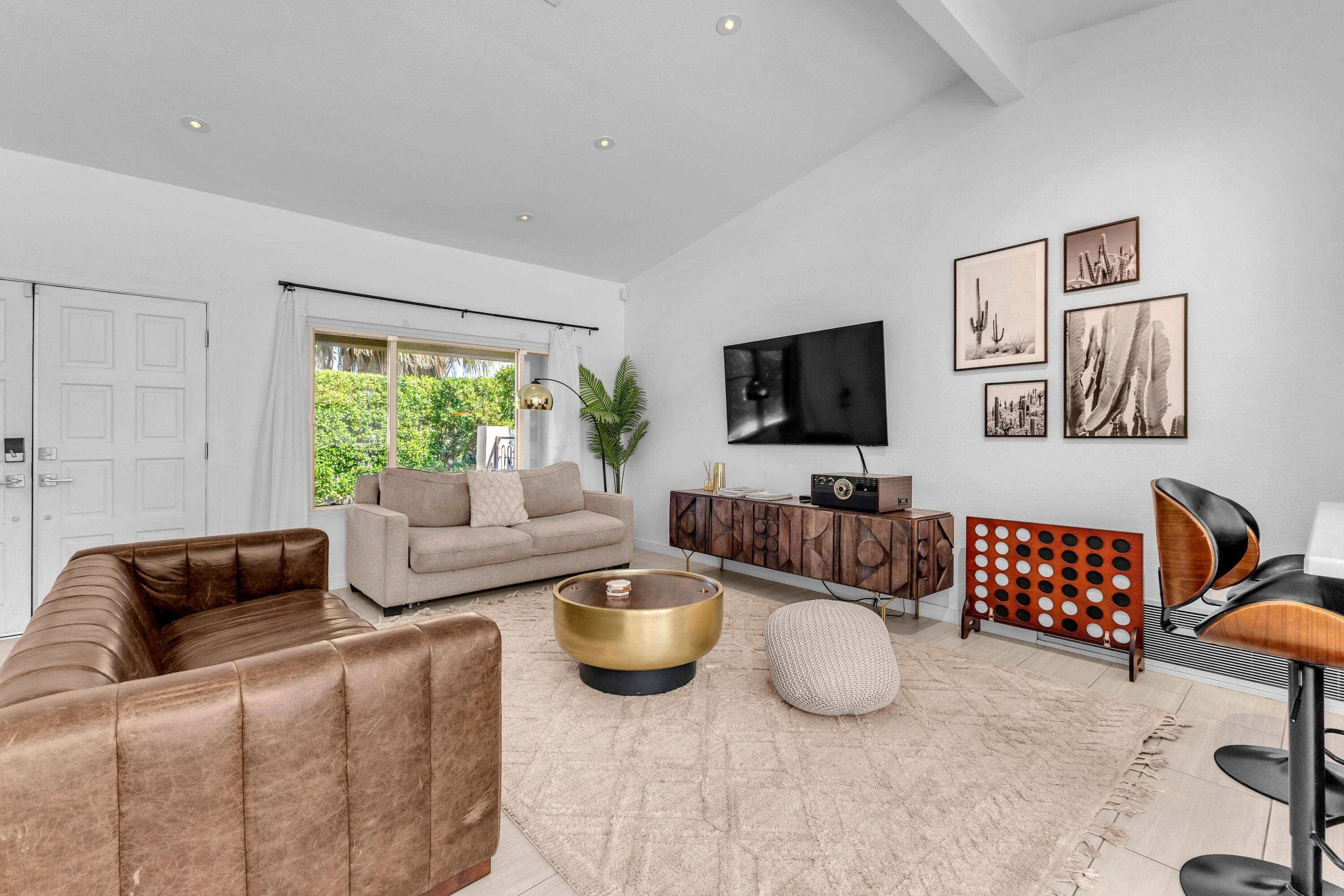 2355 West Nicola Road Palm Springs, CA 92262 - Photo 16 of 54 a living room with furniture and a flat screen tv
