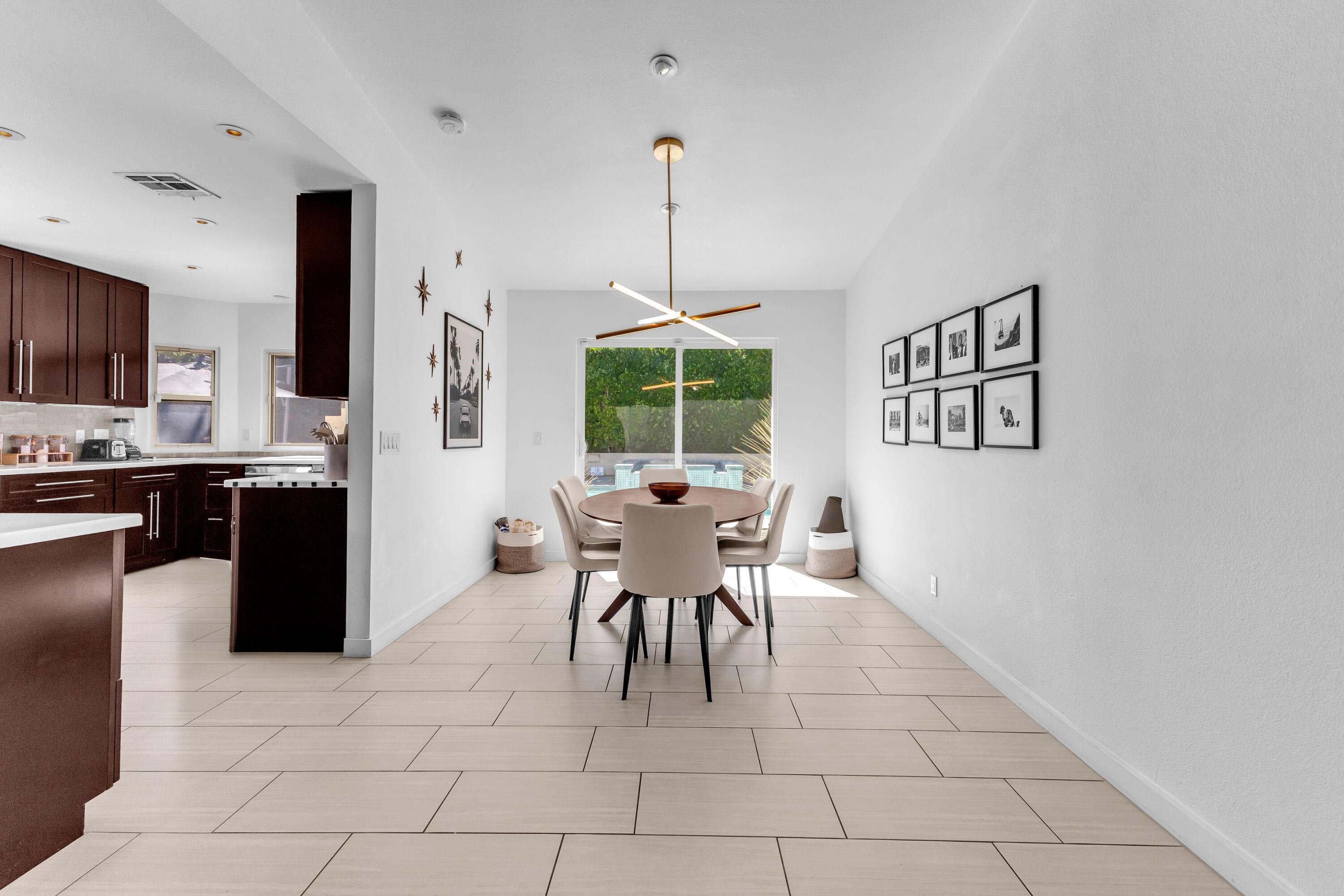 2355 West Nicola Road Palm Springs, CA 92262 - Photo 22 of 54 a dining room with furniture and window