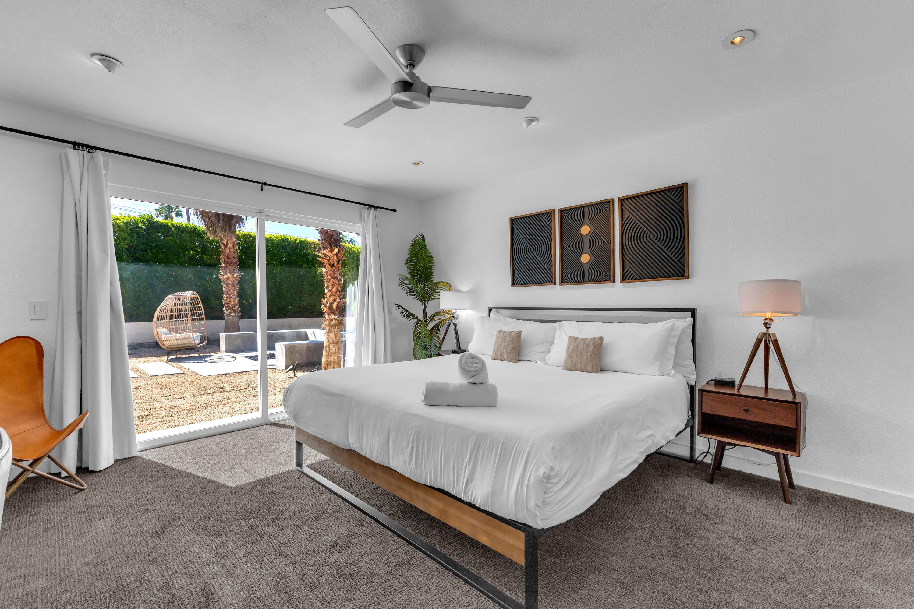 2355 West Nicola Road Palm Springs, CA 92262 - Photo 29 of 54 a bedroom with a bed and a flat tv screen